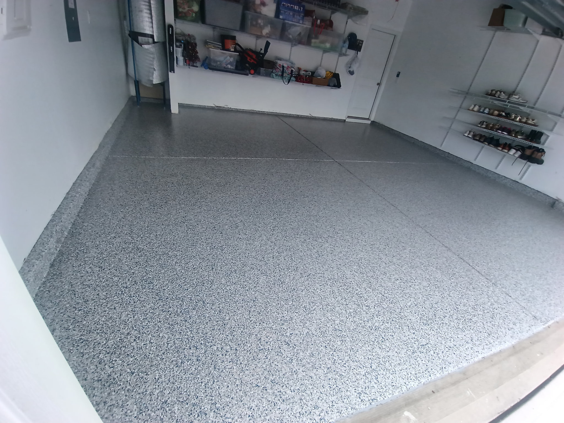 Finished grey flake garage floor coating in a two-car garage